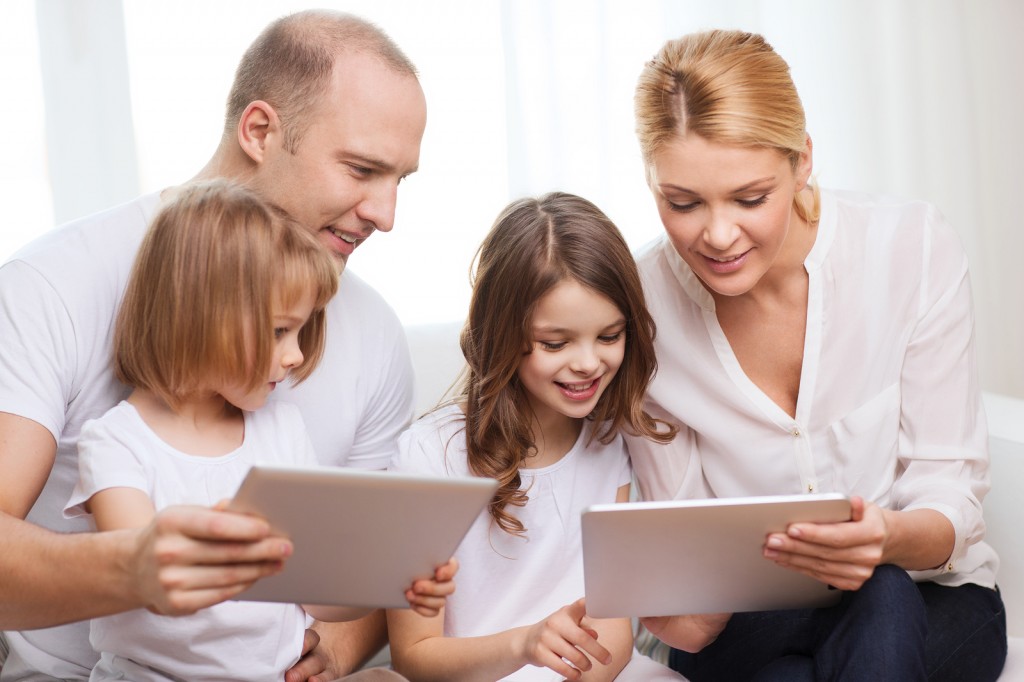family, children, technology, money and home concept - smiling f